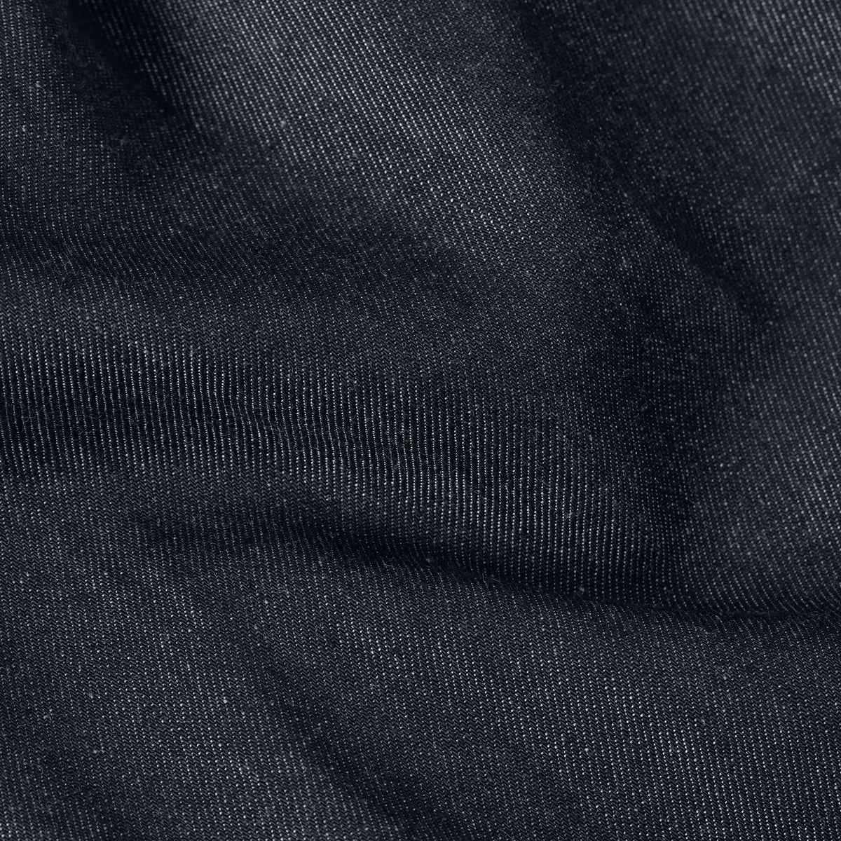 Lightweight relaxed shirt fabric texture showing soft denim material, perfect for a casual look.