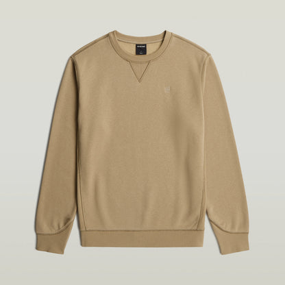 Premium Core Sweater en color beige con cuello redondo y manga larga.