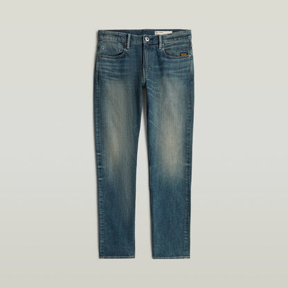 Mosa straight jeans, medio talle, diseño atemporal, pierna estrecha, teñido índigo con matiz verde.