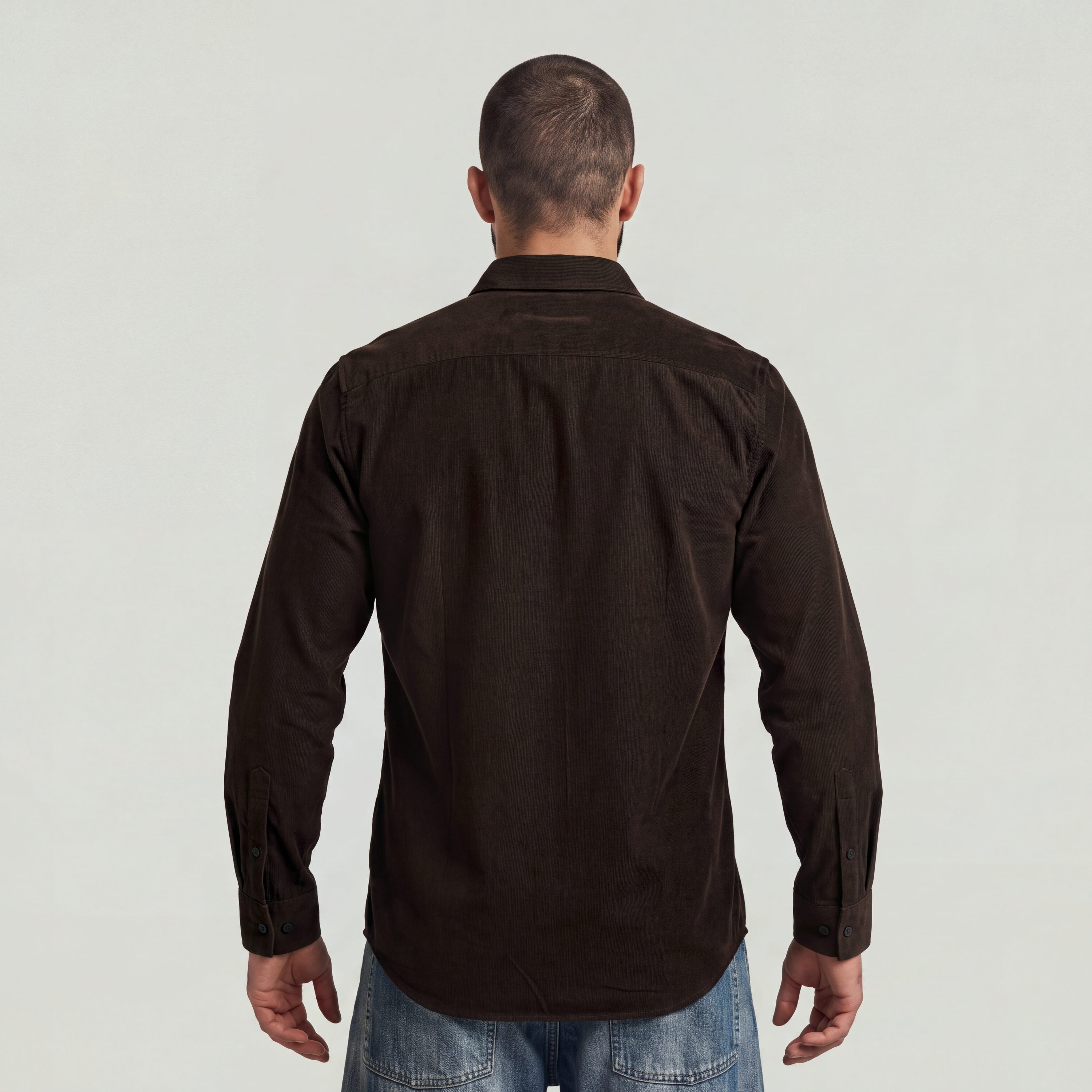 Back view of a man wearing a classic regular fit button-up shirt in brown with button closure.