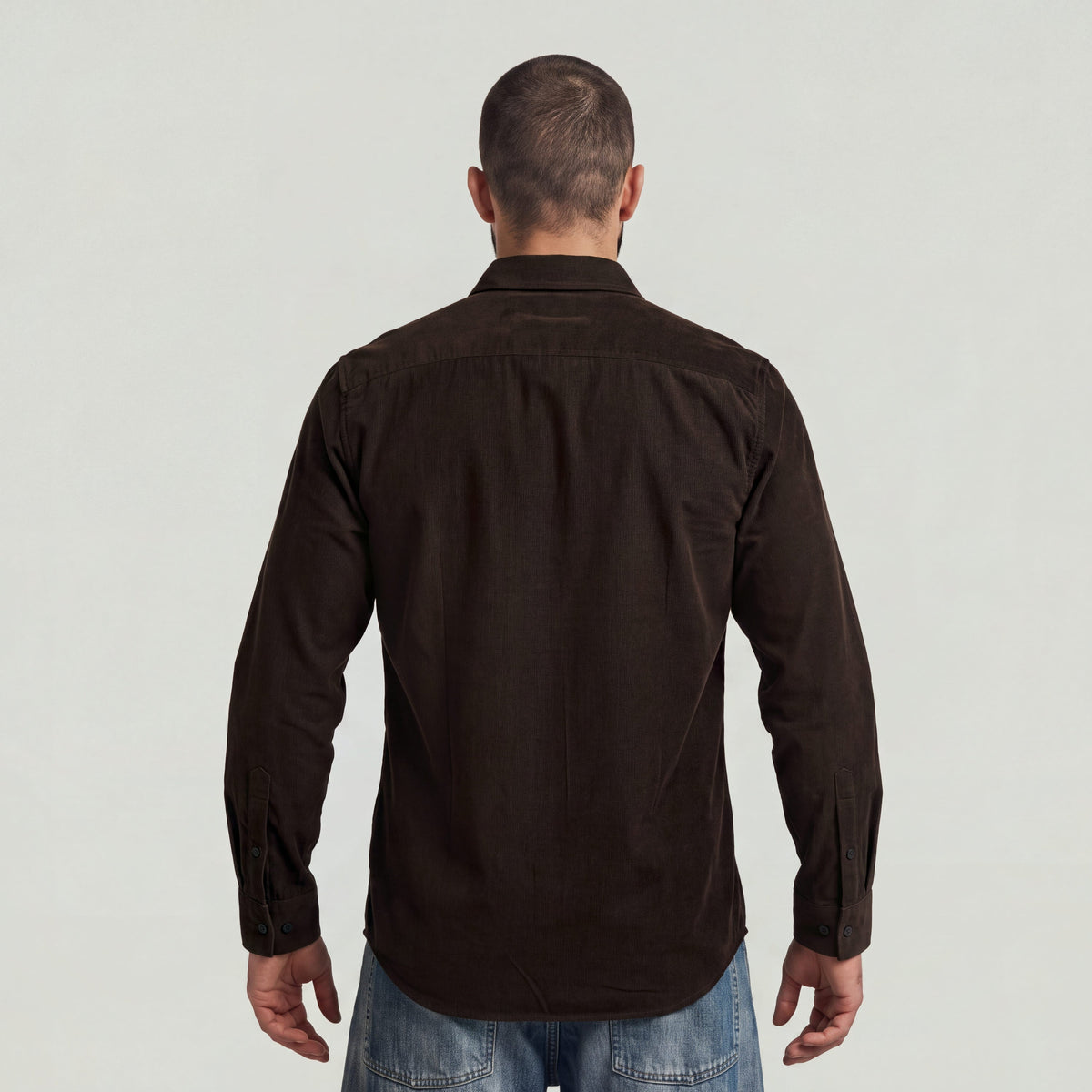 Back view of a man wearing a classic regular fit button-up shirt in brown with button closure.