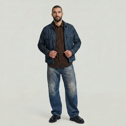 Model wearing a classic regular fit button-up shirt with denim jacket and jeans, showcasing a trendy outfit.