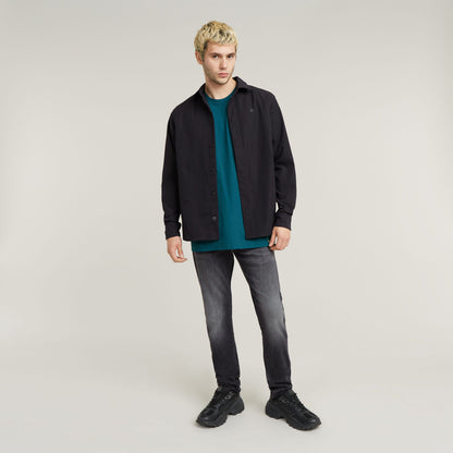 Con una confección atemporal y un corte ajustado, los vaqueros 3301 son un auténtico básico del armario. Hechos para durar. Perfecto para el día a día. Bragueta de botones,Cinco bolsillos,Etiqueta trasera de G-Star RAW hecha de un tejido de papel que imita a la piel 91 % Algodón, 8 % Elastomultiéster (T400® EcoMade), 1 % Elastano (LYCRA®),Superelástico,Denim de 10,2 onzas de peso,Sarga cruzada 3x1 Faded Black Magnet