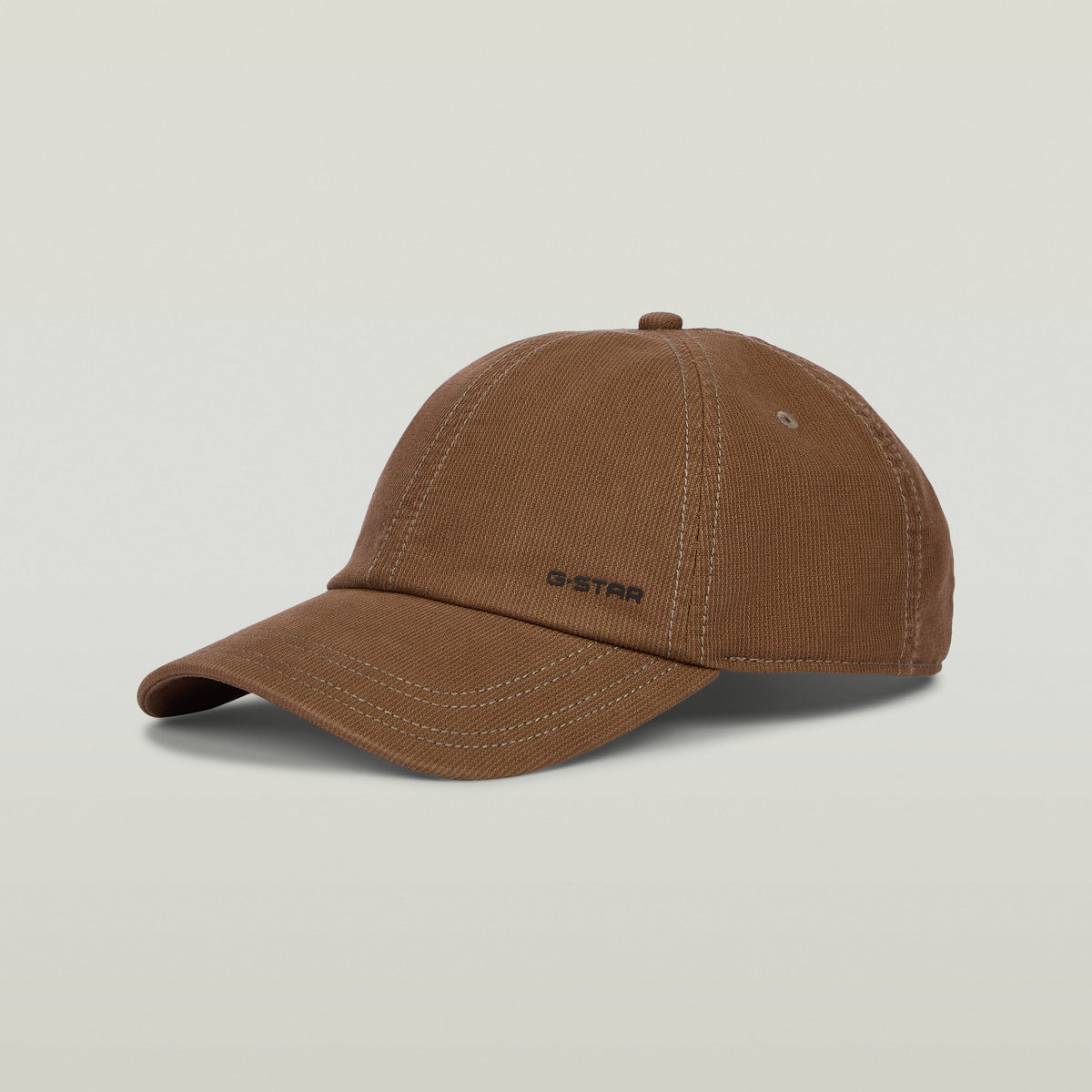 Avernus baseball cap in brown with G-STAR logo, featuring a six-panel design and adjustable clip closure.
