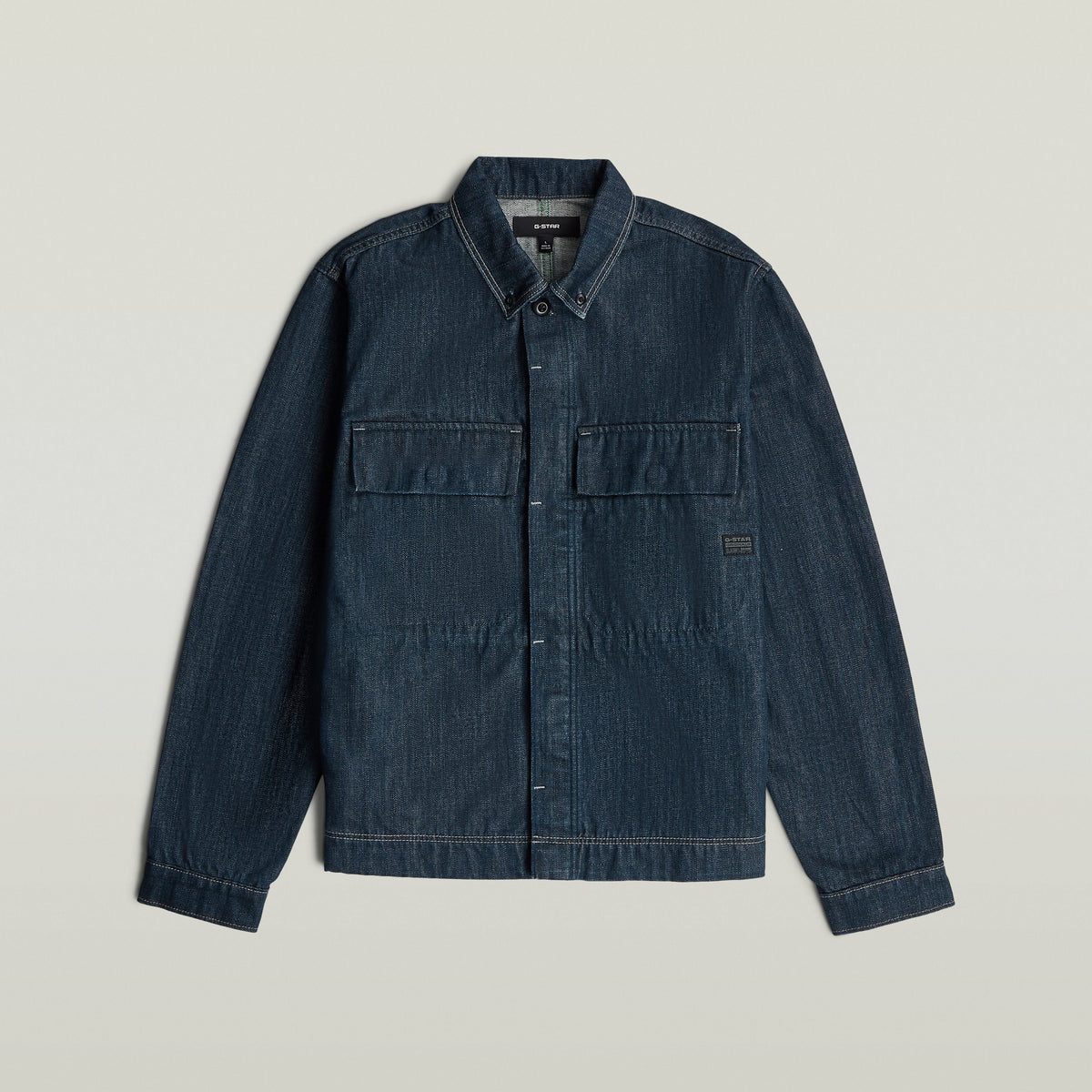 Boxy Clean Denim Overshirt in dark greencast denim with button closure and chest pockets.