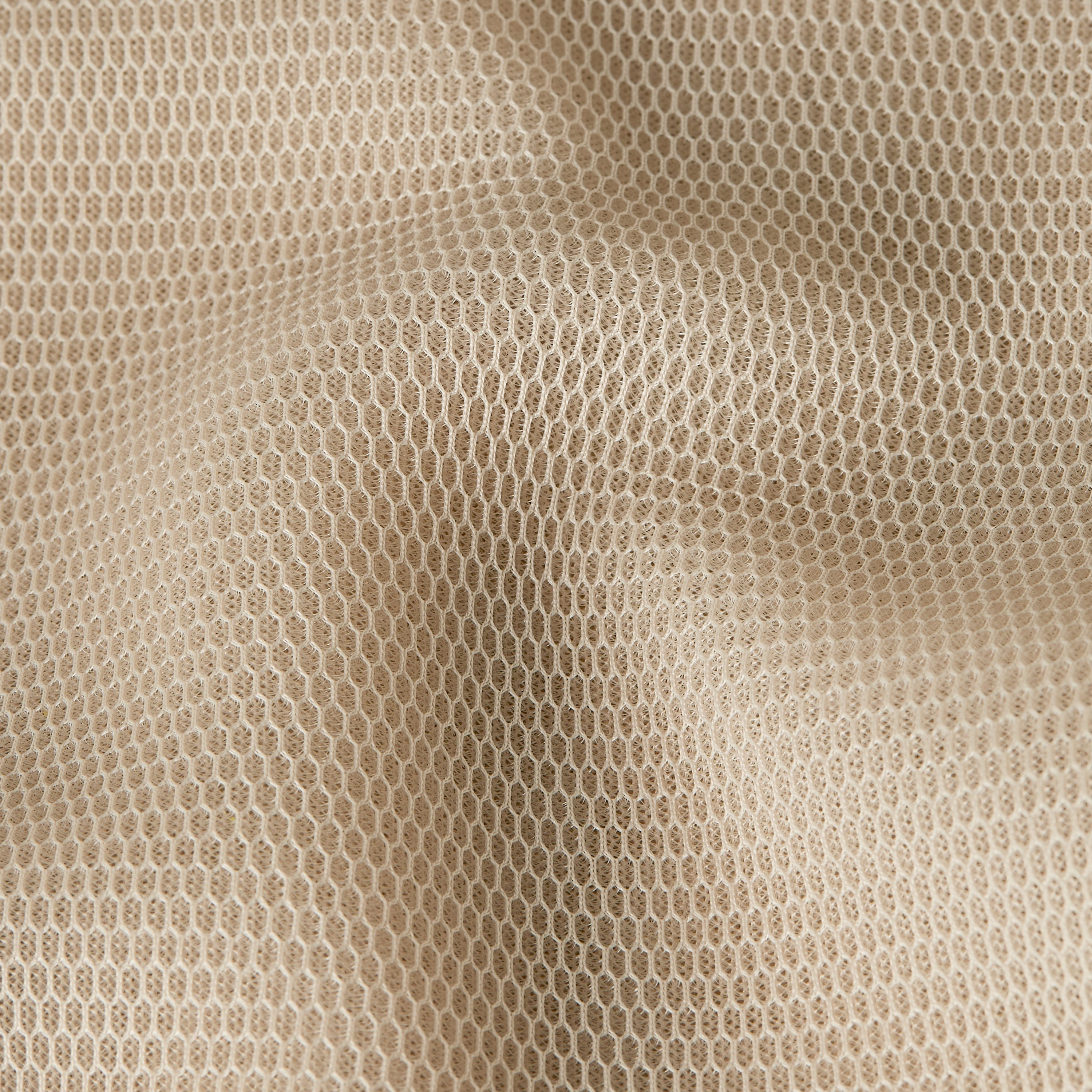Close-up of the fabric texture of the relaxed zip thru sweater with a honeycomb mesh pattern.