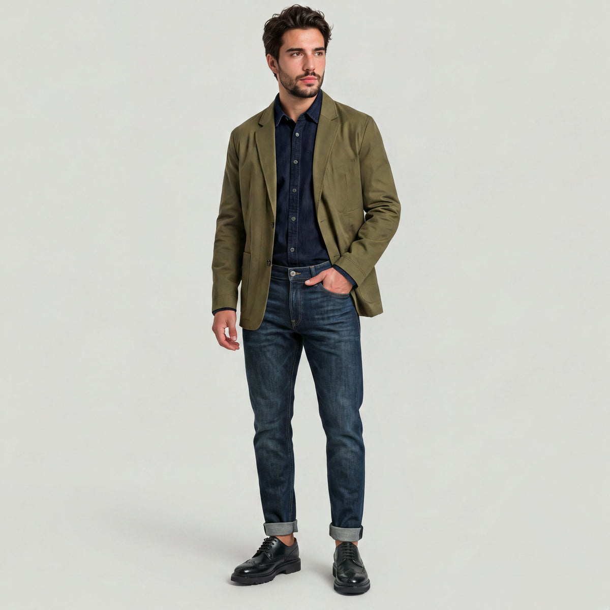 Man wearing a sport blazer for versatile style with jeans and stylish shoes.