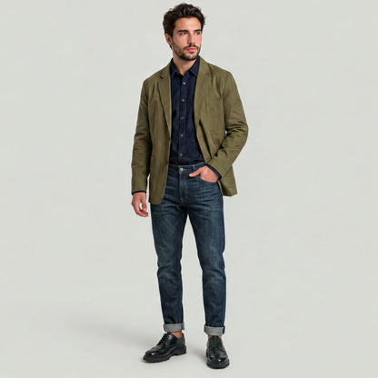 Man wearing a sport blazer for versatile style with jeans and stylish shoes.