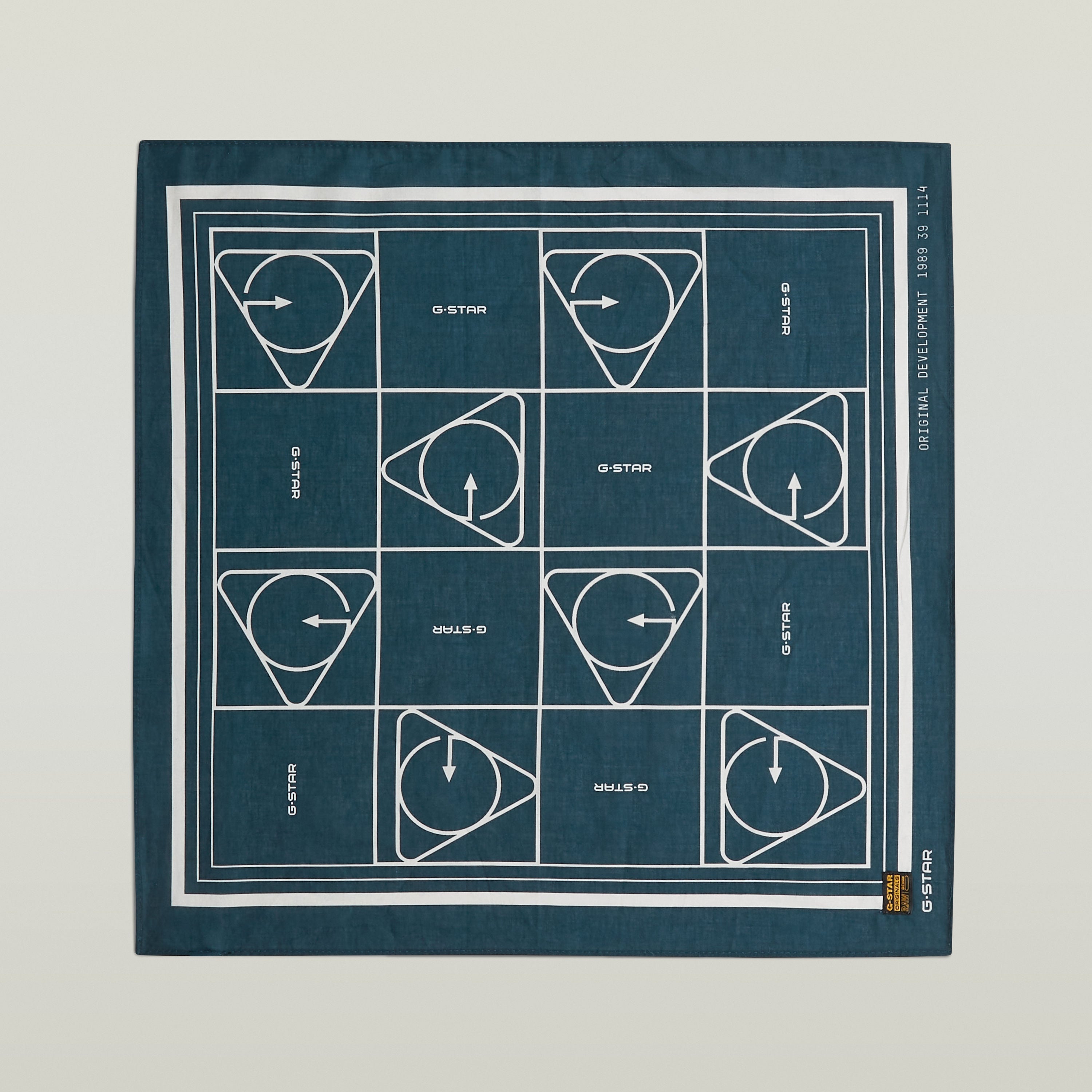 Geometric print bandana featuring a modern geometric design in blue and white with durable edges.