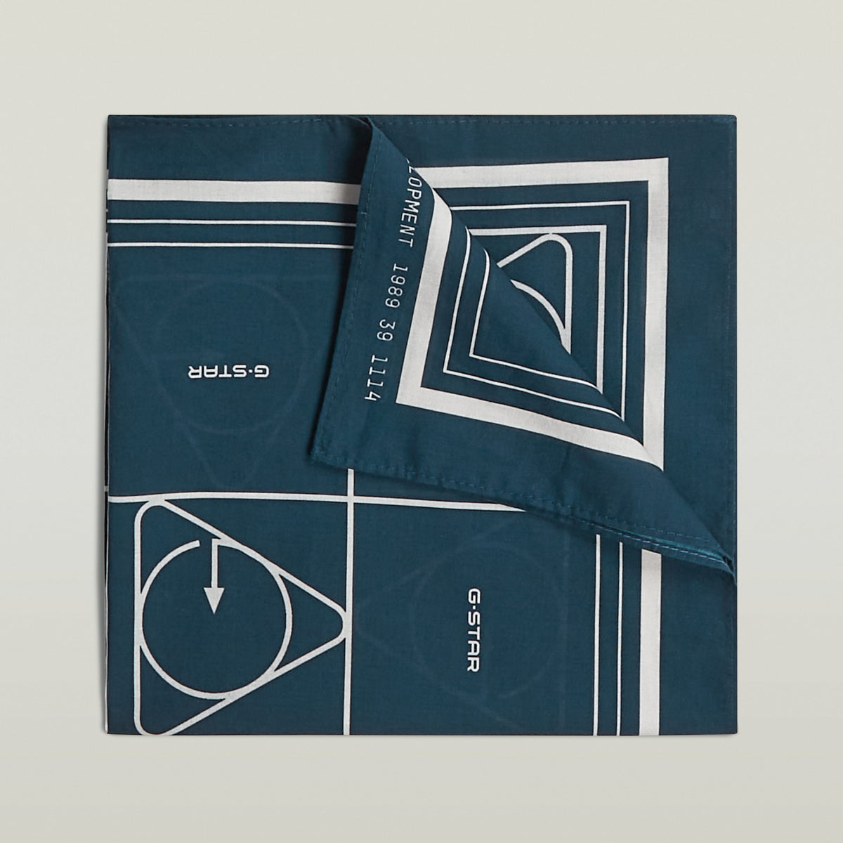 Geometric print bandana featuring a bold geometric design in dark blue and white.