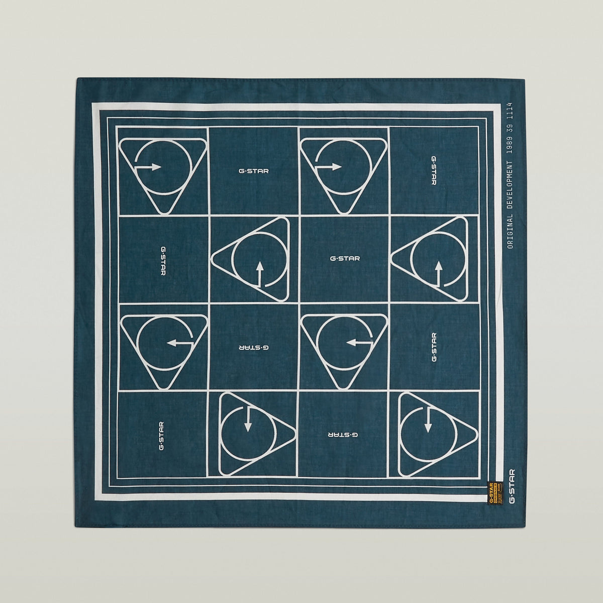 Geometric print bandana in dark blue with a geometric pattern and durable finished edges for versatility.