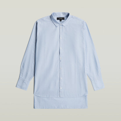 Relaxed Step Hem Shirt in light blue with vertical stripes and button closure.