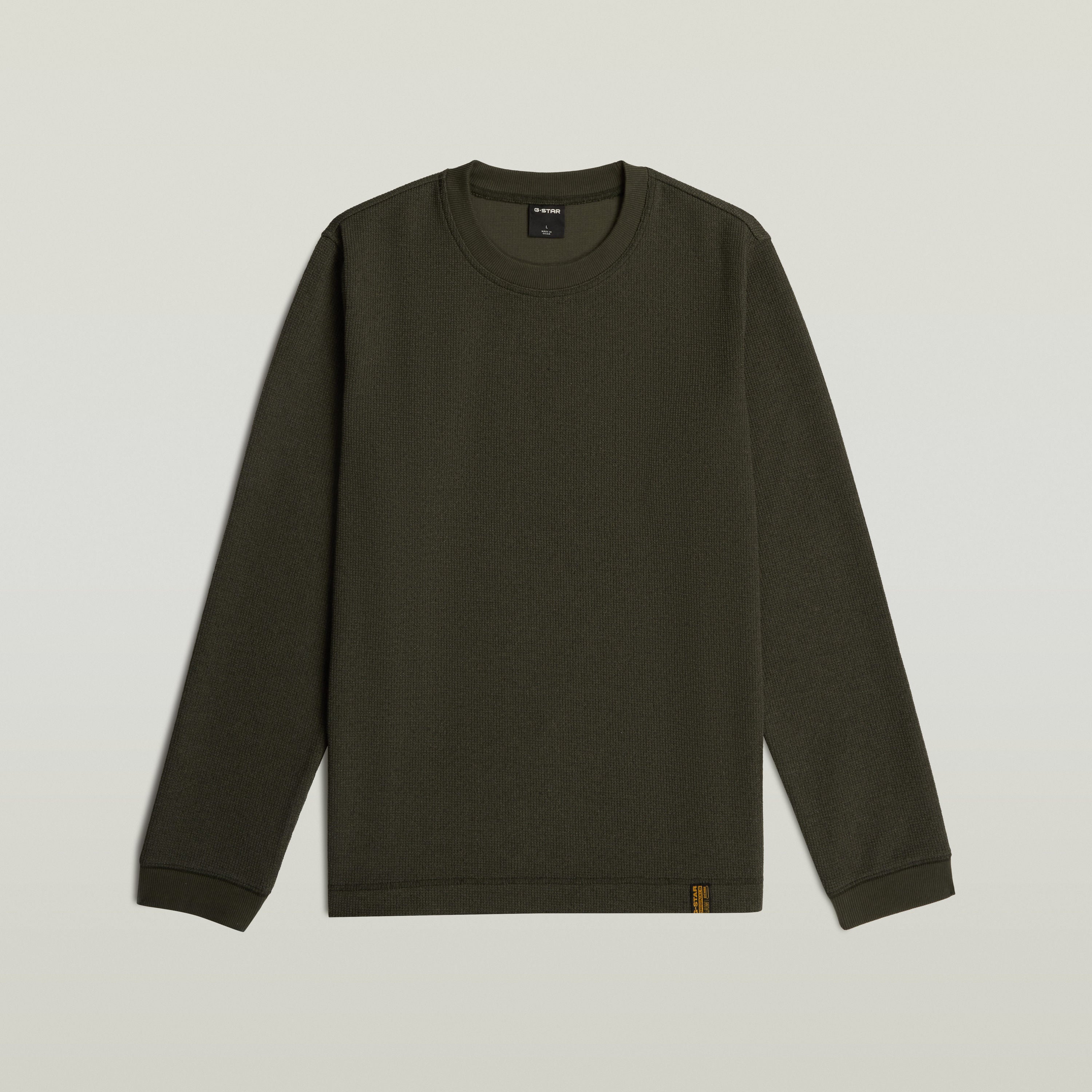 Brushed long sleeve t-shirt in dark green color, featuring a classic round neckline and long sleeves.