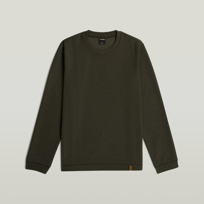 Brushed long sleeve t-shirt in dark green color, featuring a classic round neckline and long sleeves.