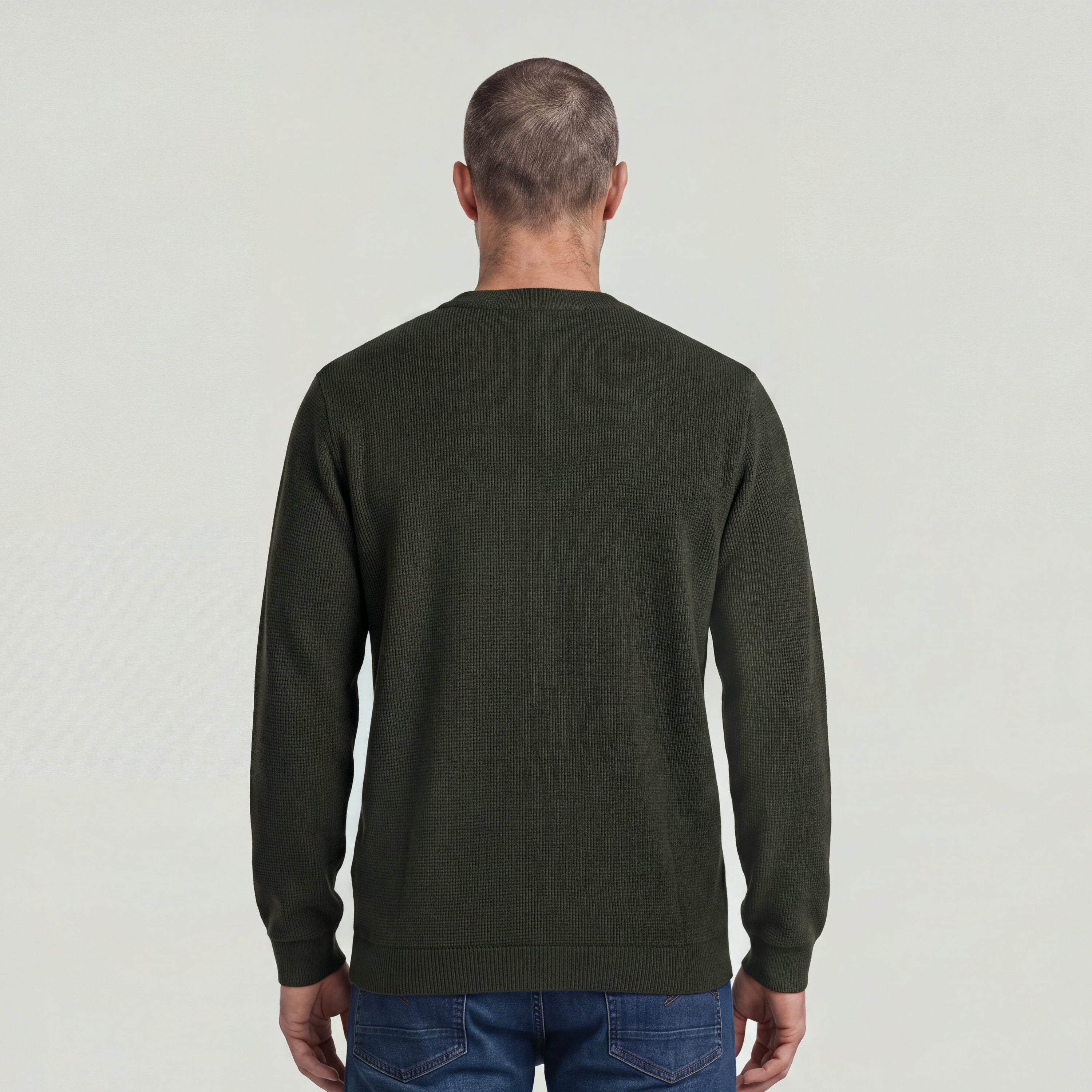 Back view of a man wearing a brushed long sleeve t-shirt in olive green.