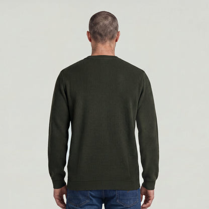 Back view of a man wearing a brushed long sleeve t-shirt in olive green.