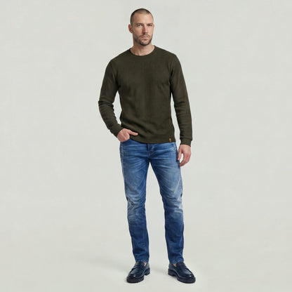 Man wearing a brushed long sleeve t-shirt with jeans, showcasing a casual and stylish outfit.
