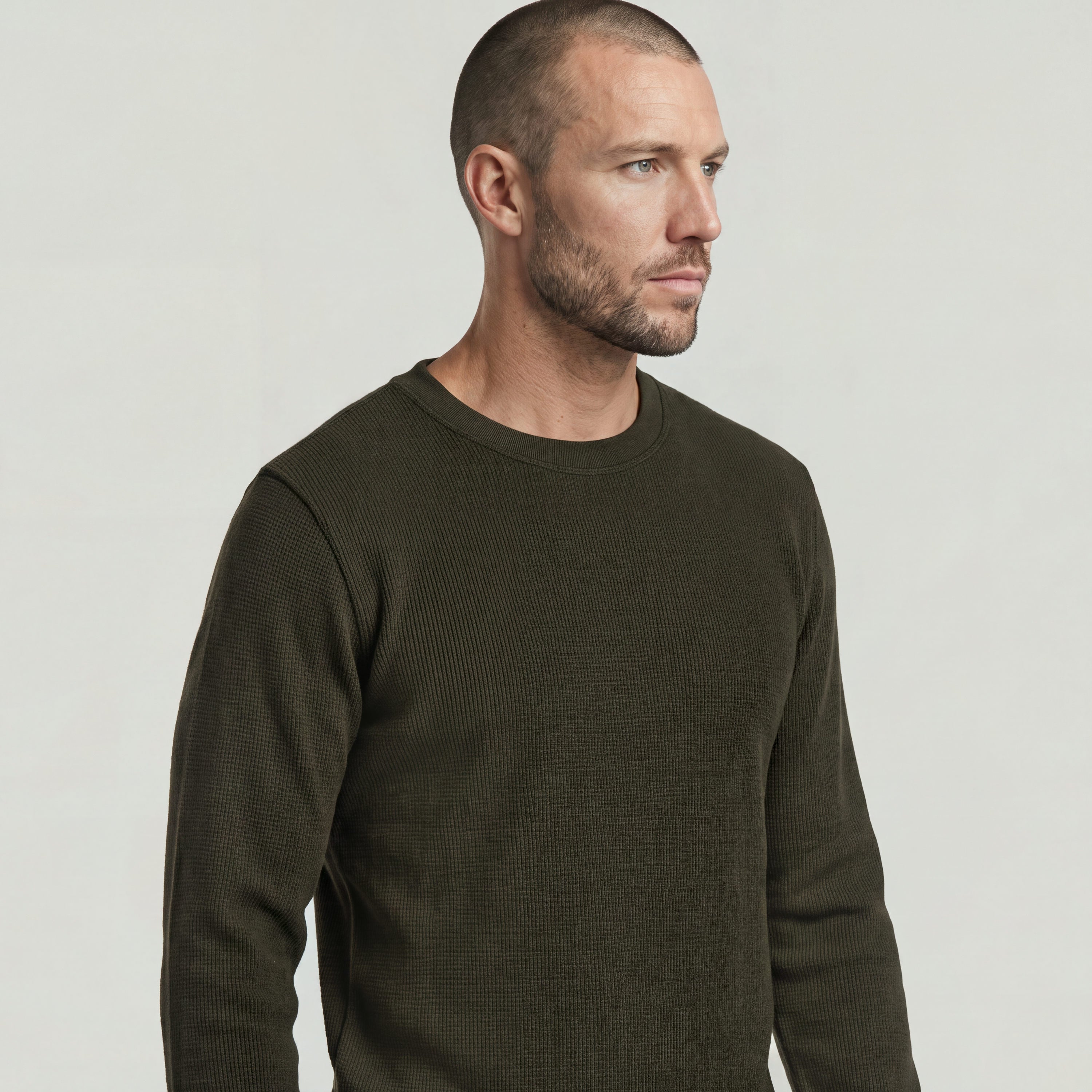 Brushed long sleeve t-shirt model wearing an olive green Tweeter Brushed T-Shirt with a classic crew neck.