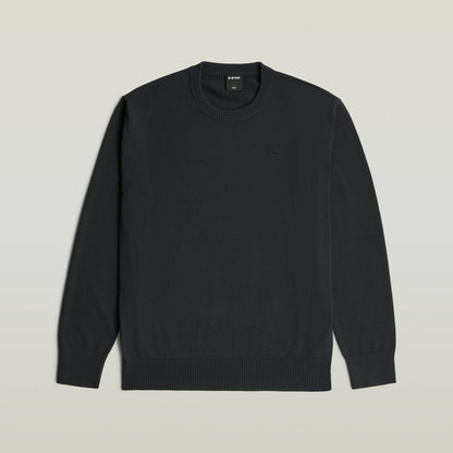 Core Refined Knit Pullover, a classic knit pullover with a round neck and long sleeves in black.