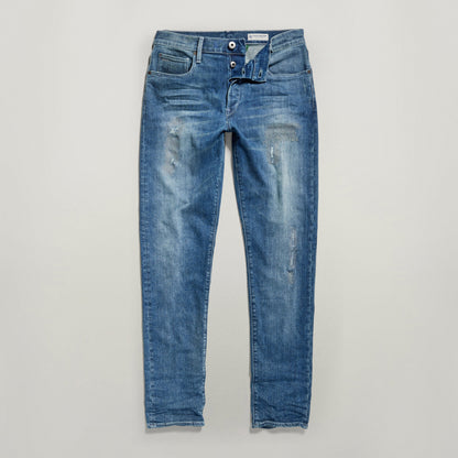 G-Star 3301 Slim jeans en acabado desgastado con bragueta de botones y diseño de cinco bolsillos.
