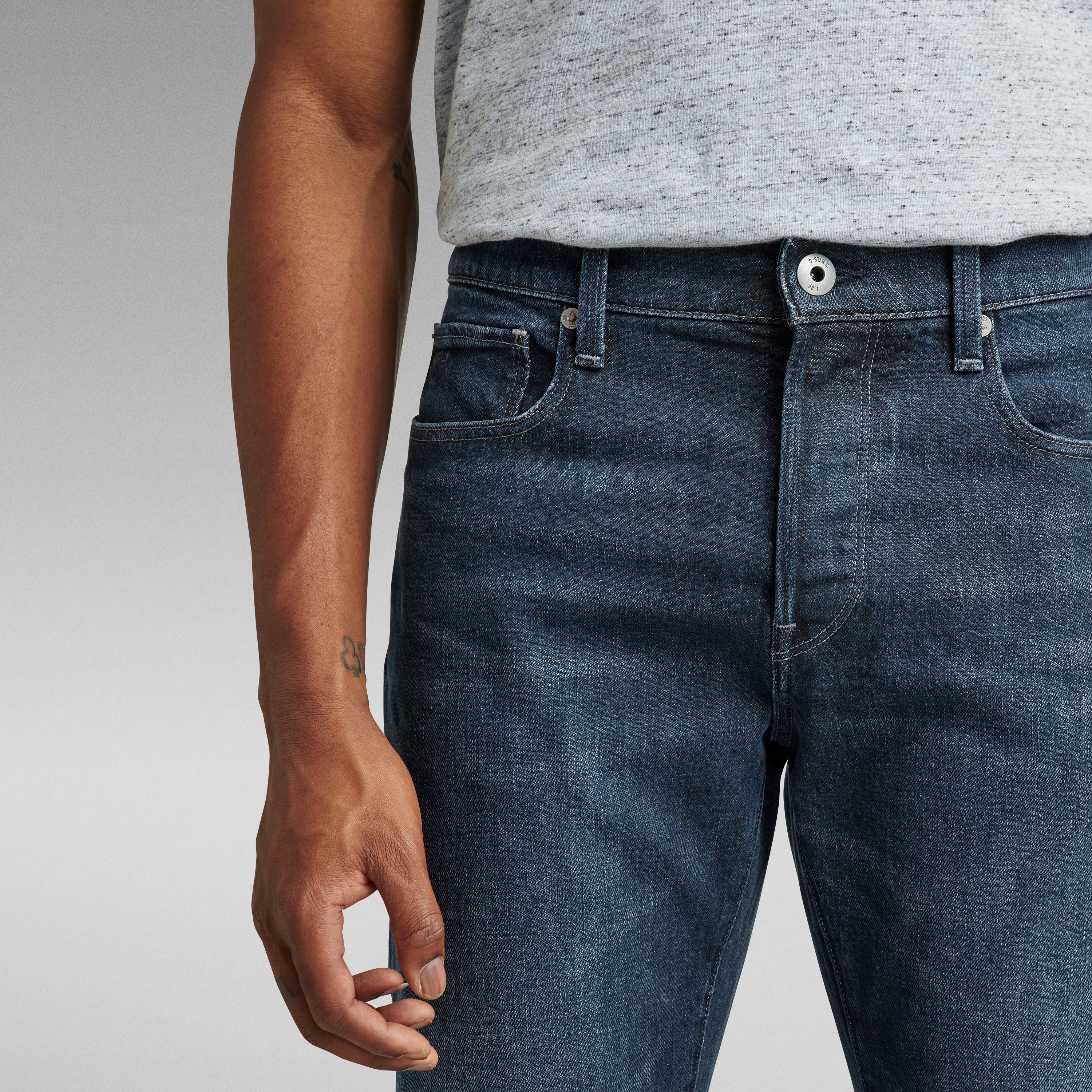 G-Star 3301 slim jeans shown in close-up with a medium rise and classic five-pocket design.