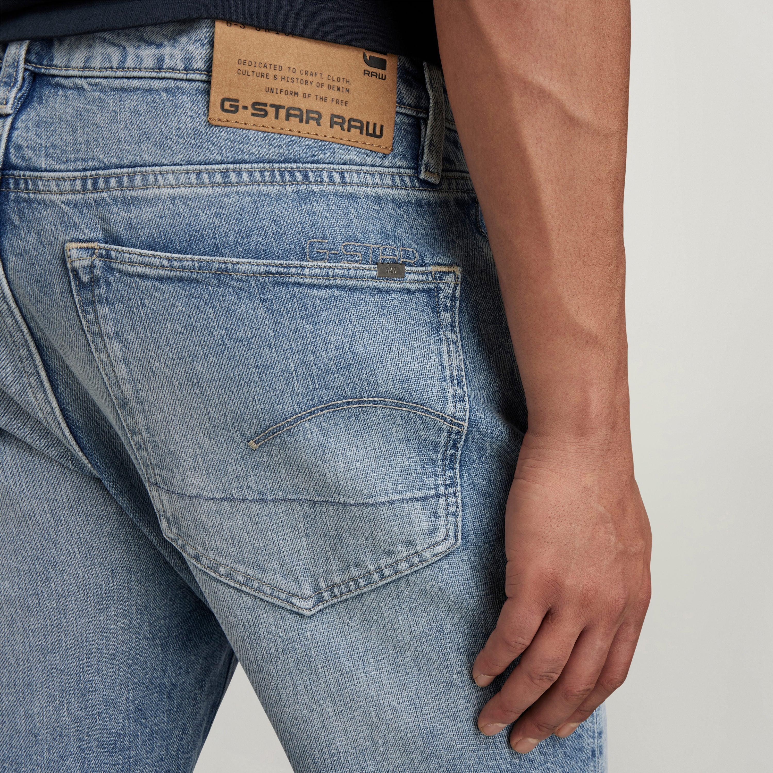 G-Star 3301 slim jeans back view showcasing pocket design and vintage Olympic Blue color.