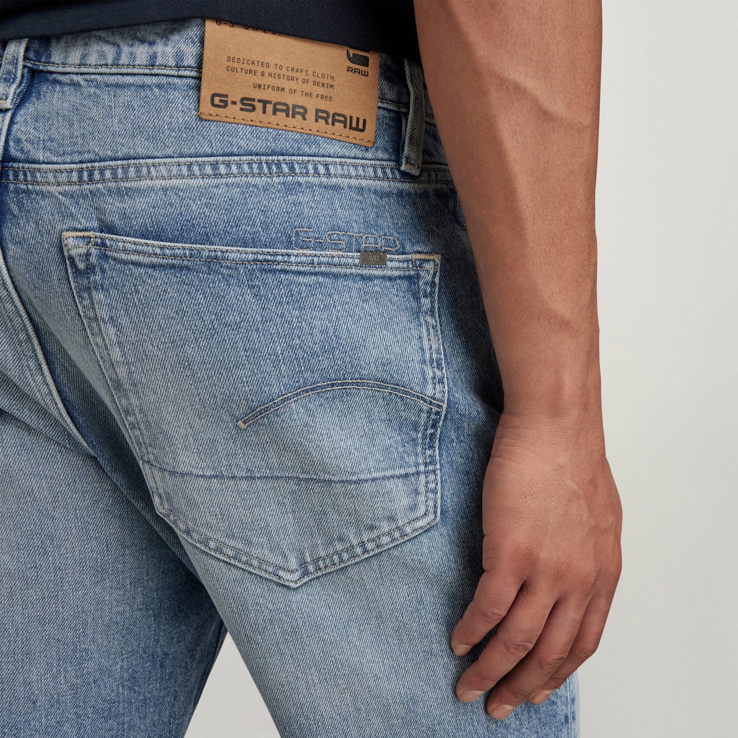 G-Star 3301 slim jeans back view showcasing pocket design and vintage Olympic Blue color.