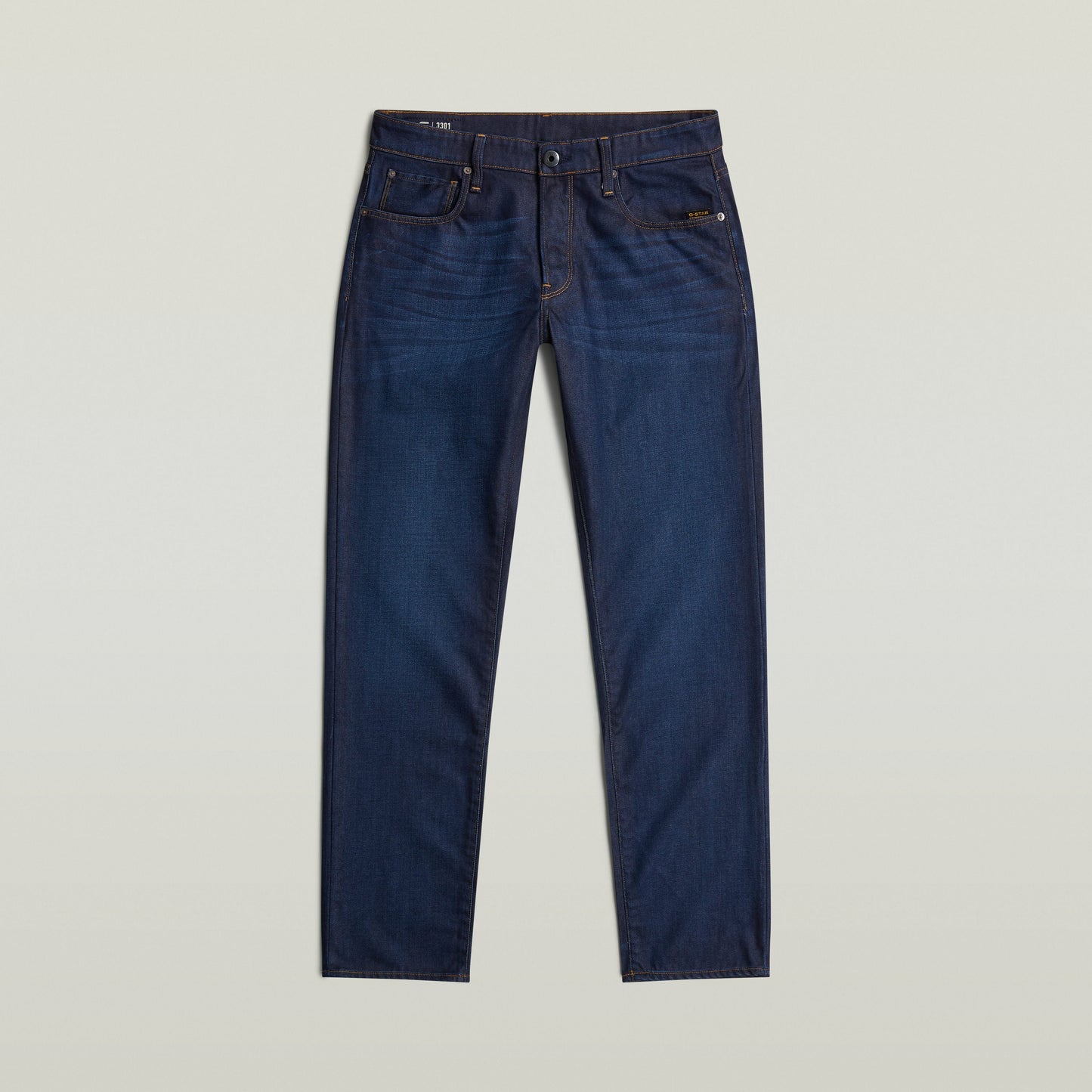 Jeans G-Star 3301 Straight en denim de color índigo con construcción de cinco bolsillos.