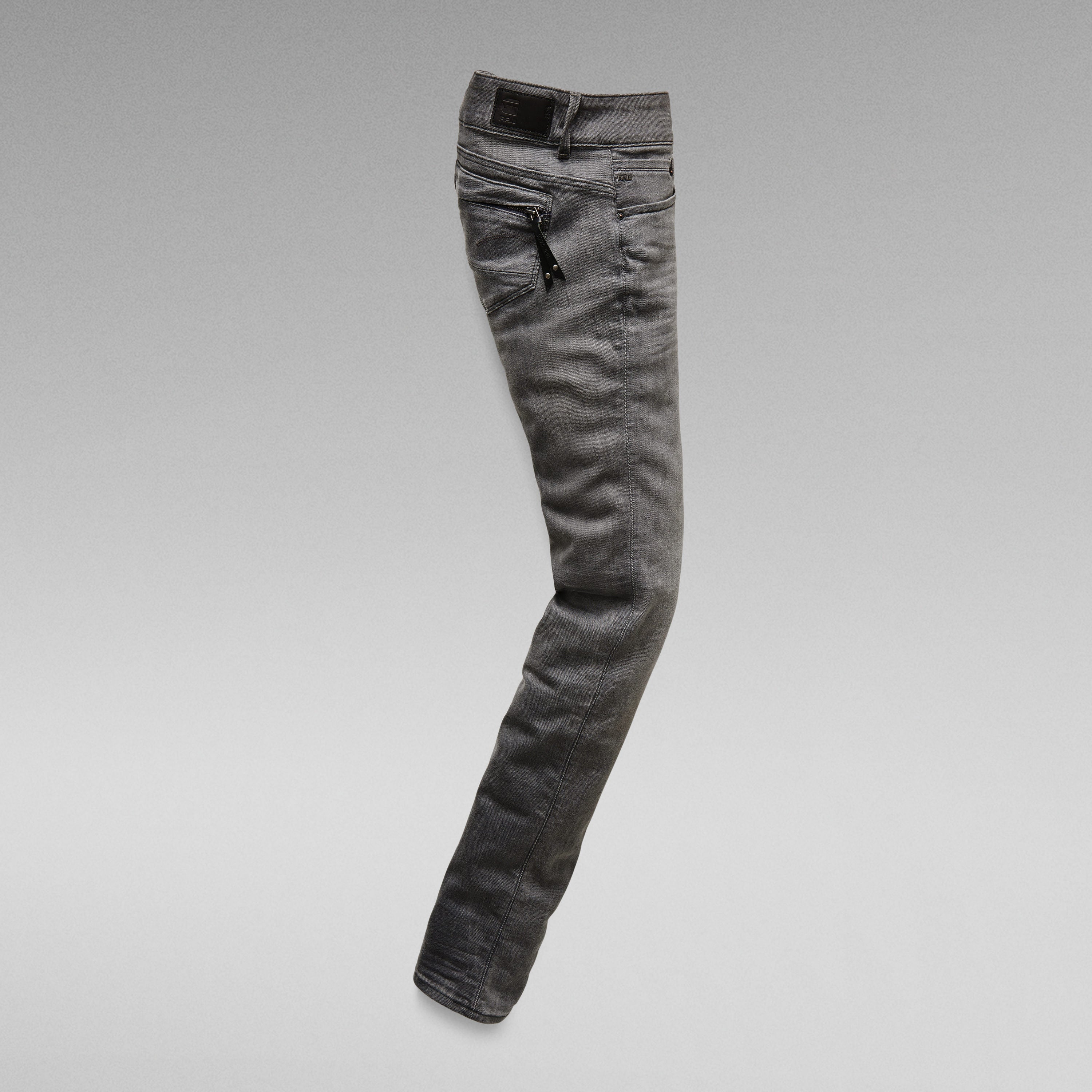 Midge Cody mid skinny jeans in grey, featuring semi-hidden zippers on back pockets, showcasing a sleek silhouette.