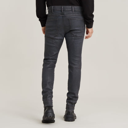 3D zip knee skinny jeans displayed from the back, showcasing detailed stitching and pocket design.