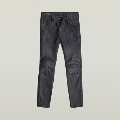 3D zip knee skinny jeans in black, featuring zippered knee pockets and reinforced stitching.