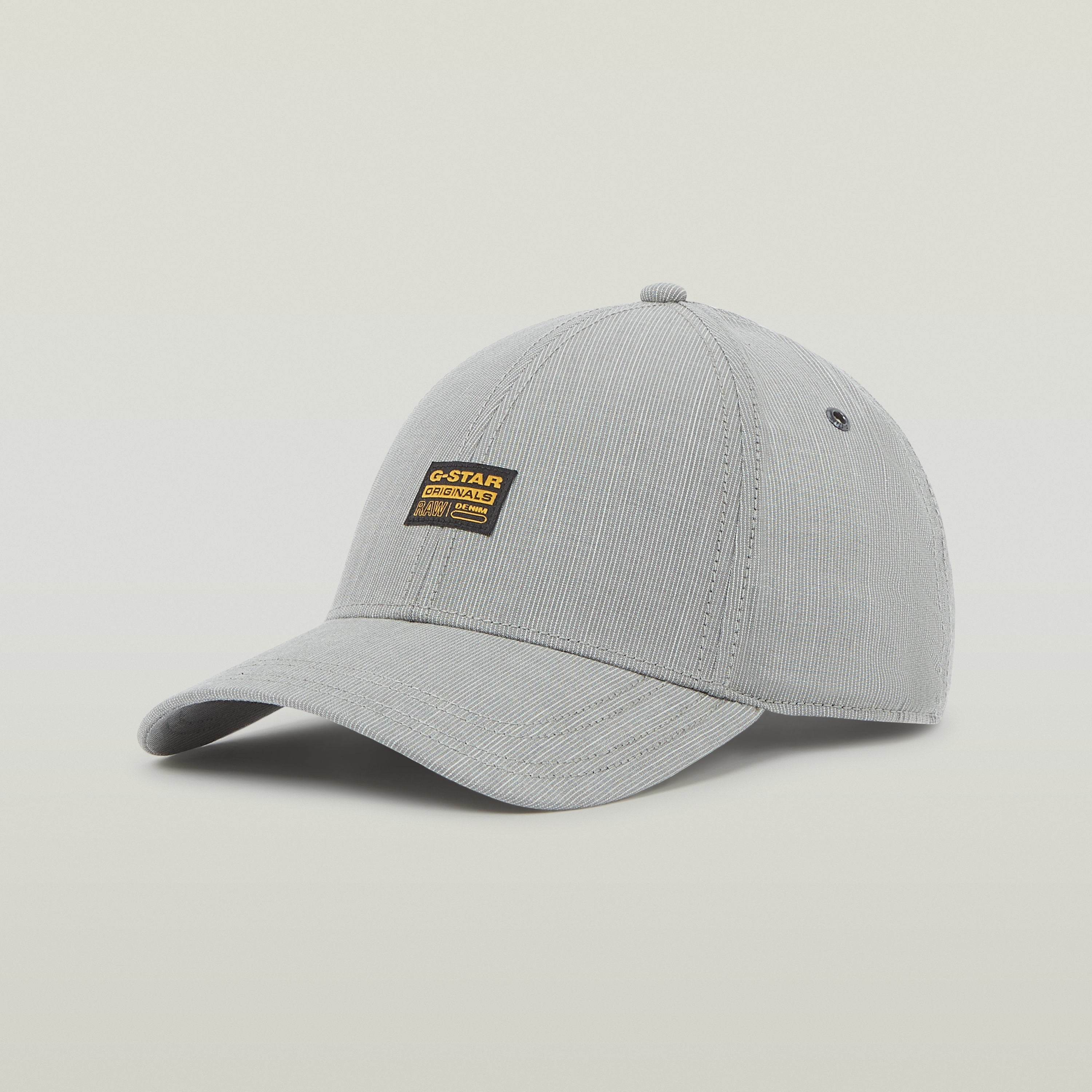 Gorra G-STAR Originals de color gris con visera curvada y etiqueta tejida en la parte delantera.