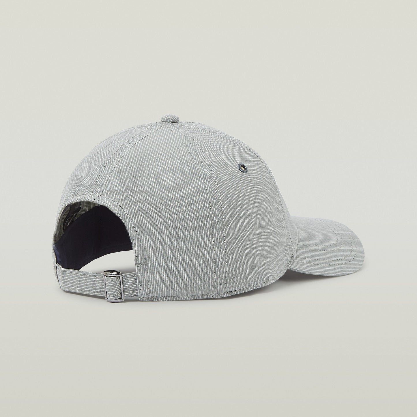Gorra G-STAR Originals en color gris con visera curvada y ajuste trasero, vista lateral.