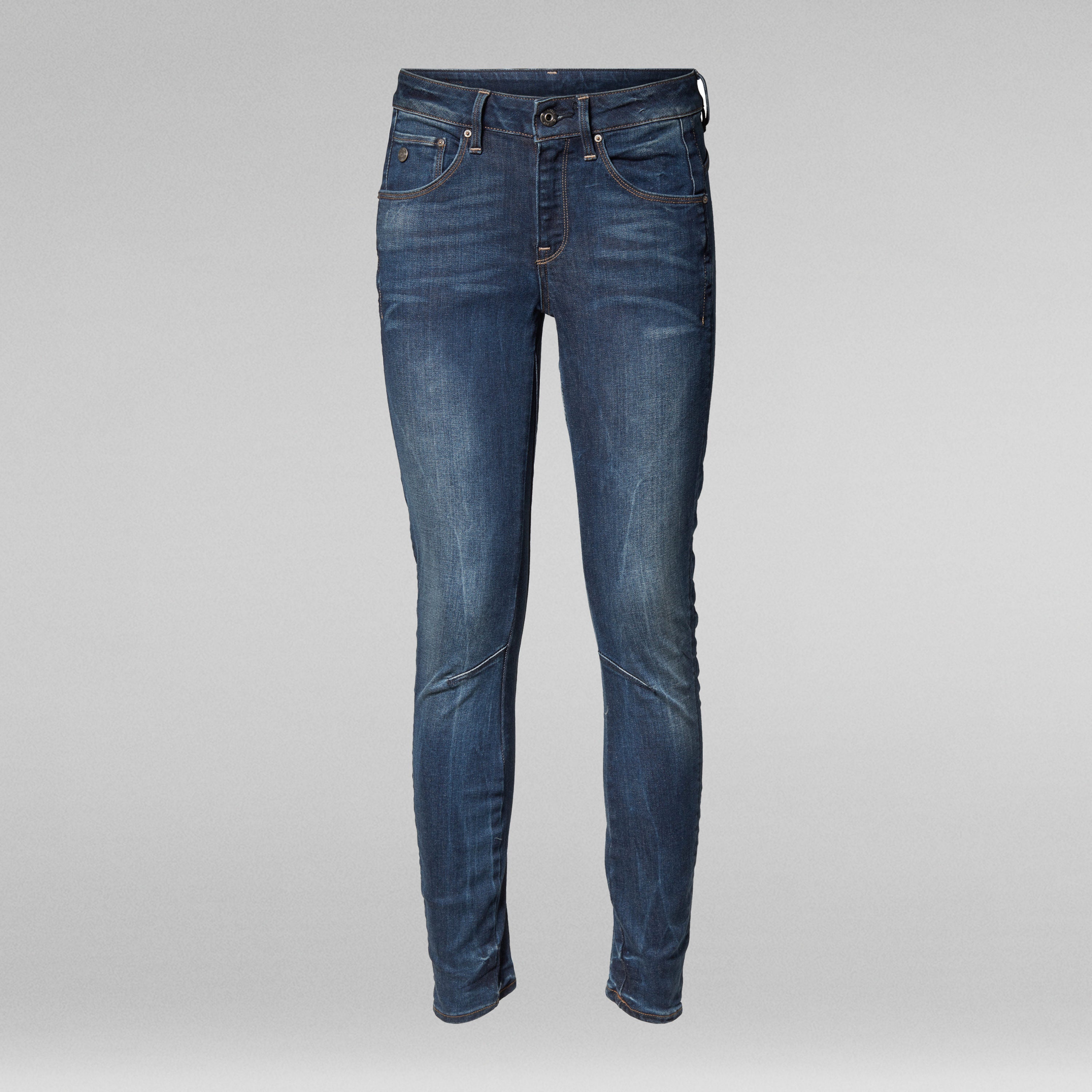 arc skinny jeans in dark blue featuring a low-rise cut and unique knee stitching for a tailored fit.