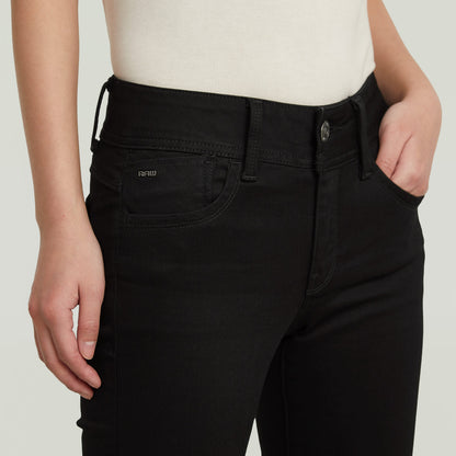 Lynn super skinny jeans in black showcasing a modern fit and five-pocket style at waist level.