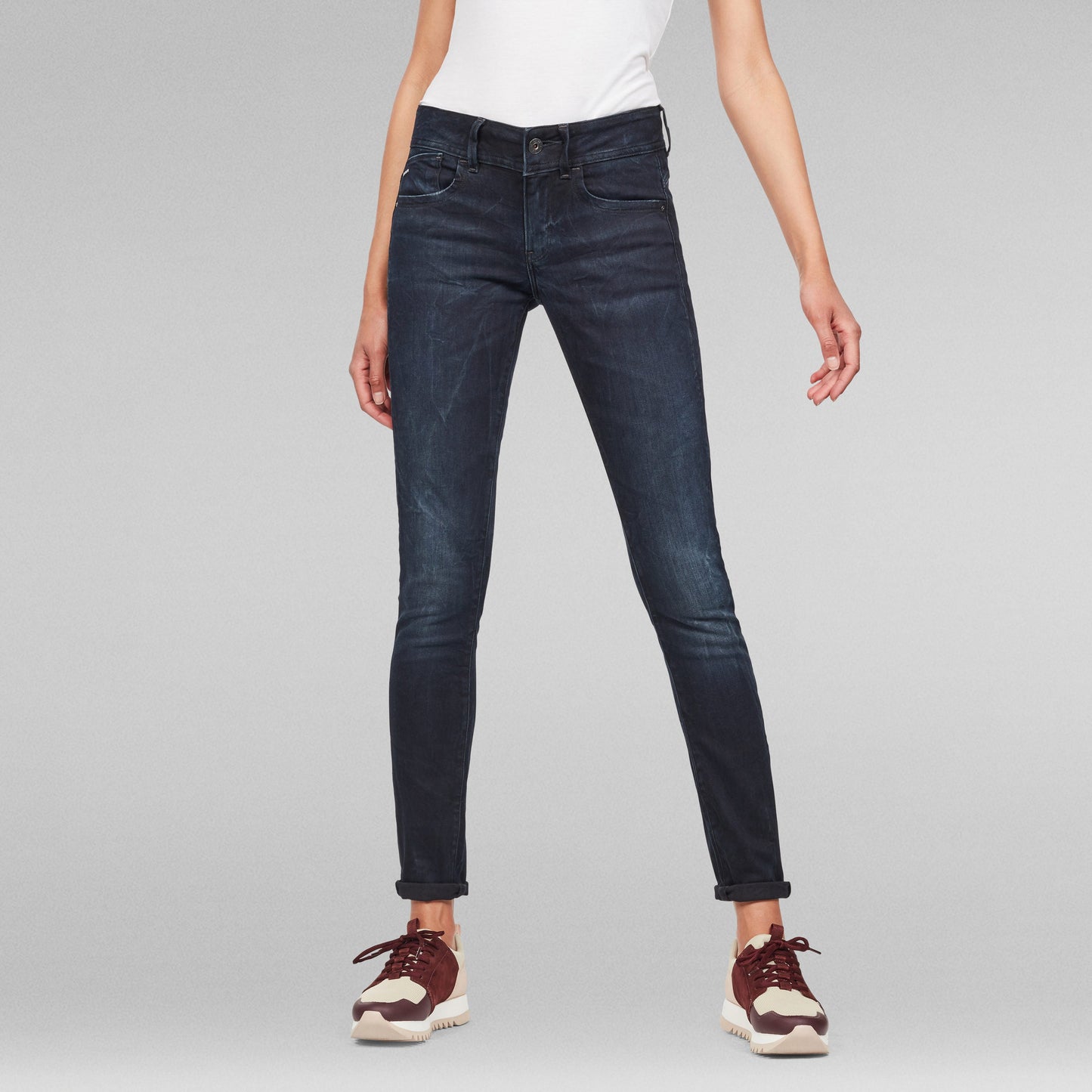 super skinny jeans for women in dark wash, stylish mid waist design with a snug fit.