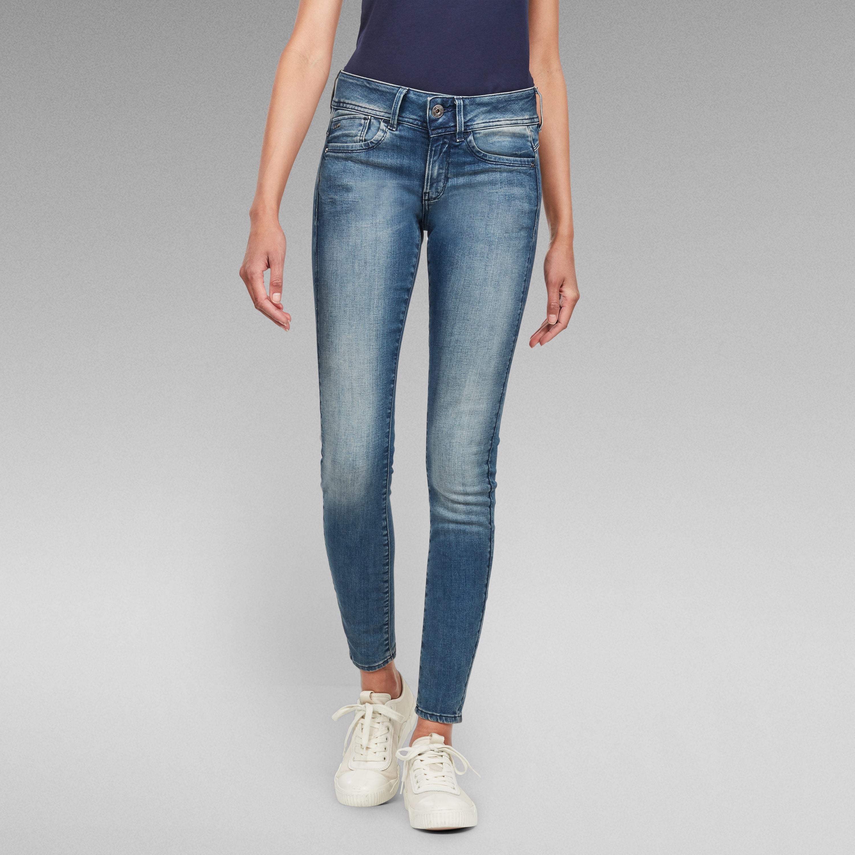 Lynn skinny fit jeans in blue wash, featuring a slim fit from waist to ankle and five pockets.
