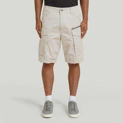 relaxed fit zip shorts in beige with functional pockets and comfortable fit.
