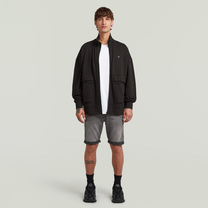G-Star 3301 slim denim shorts paired with a black jacket and white t-shirt on a male model.