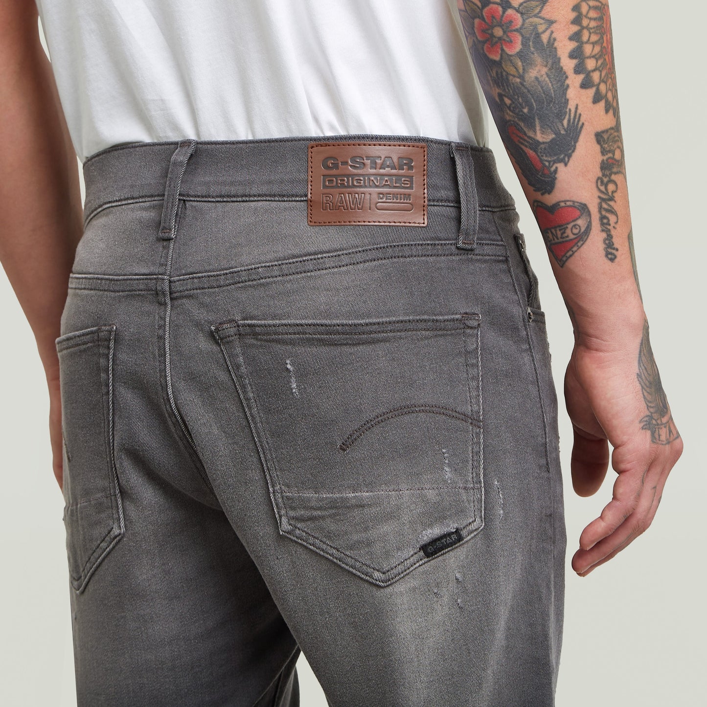 G-Star 3301 slim denim shorts showing back detail and label on gray denim fabric.