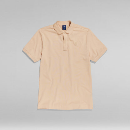 Polo Dunda Slim with ribbed collar in a light beige color, featuring a classic polo closure and short sleeves.