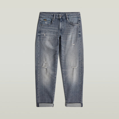 Low rise boyfriend jeans in distressed denim with relaxed fit and rolled hem.