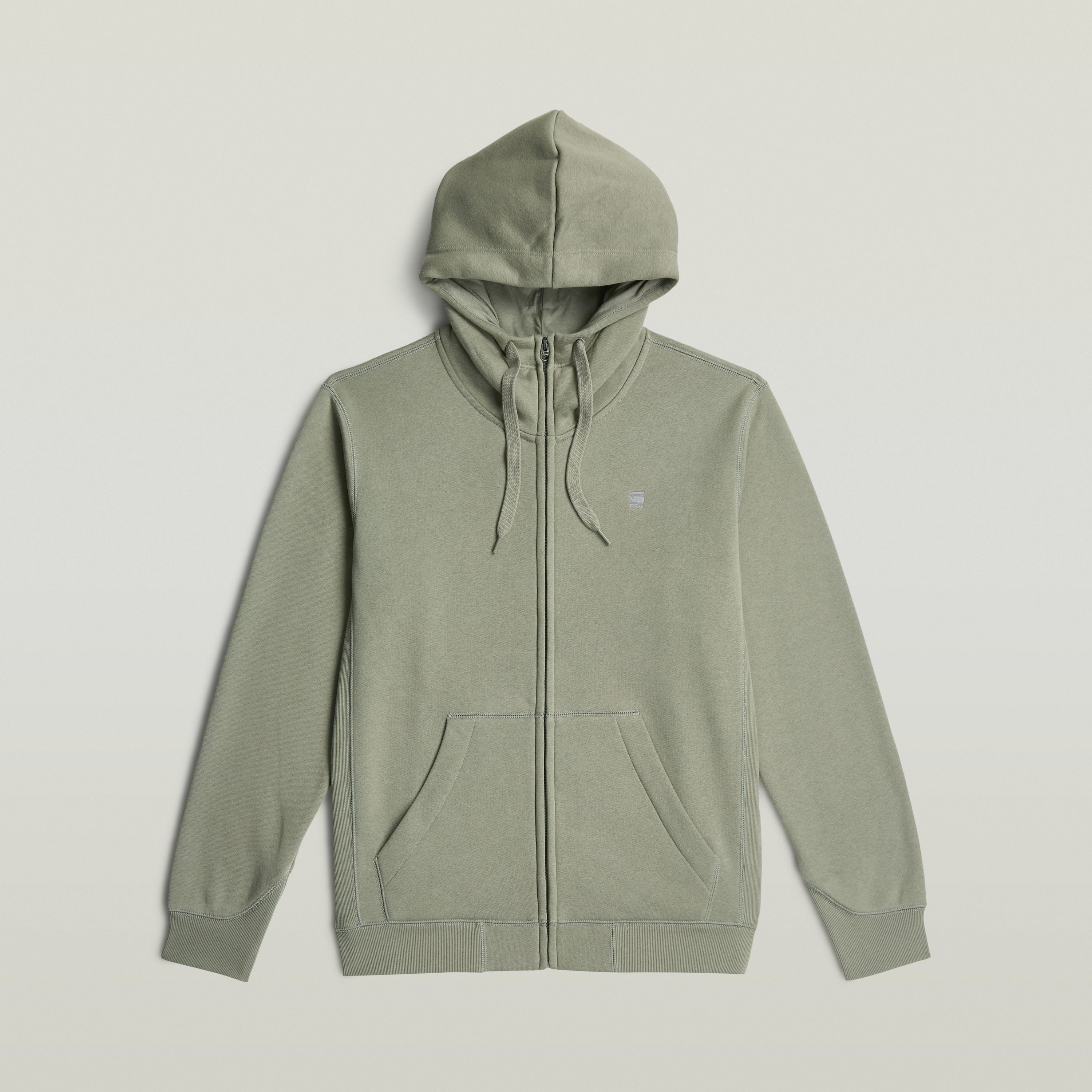 Sudadera Premium Core Hooded Zip en color verde con cremallera y capucha ajustable, estilo moderno y cómodo.