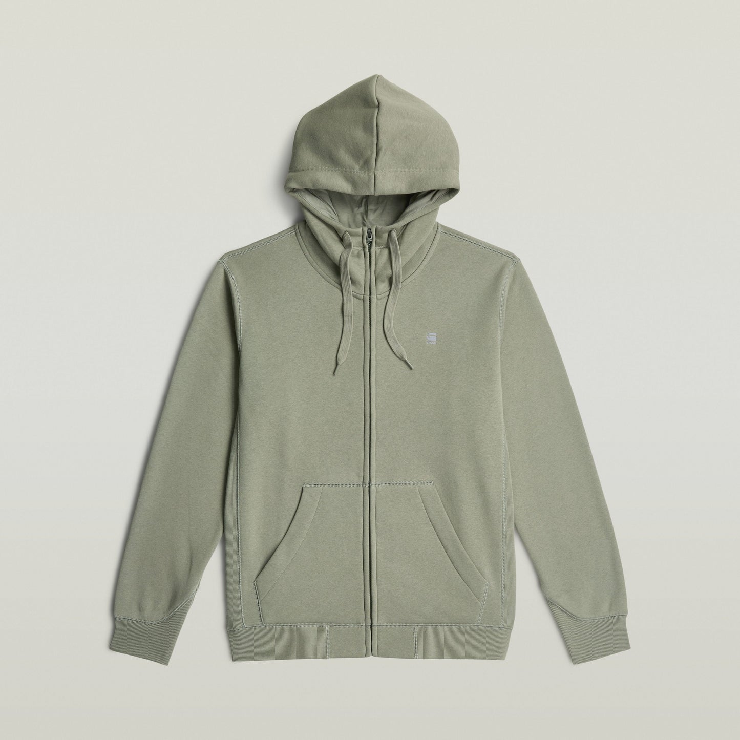 Sudadera Premium Core Hooded Zip en color verde con cremallera y capucha ajustable, estilo moderno y cómodo.