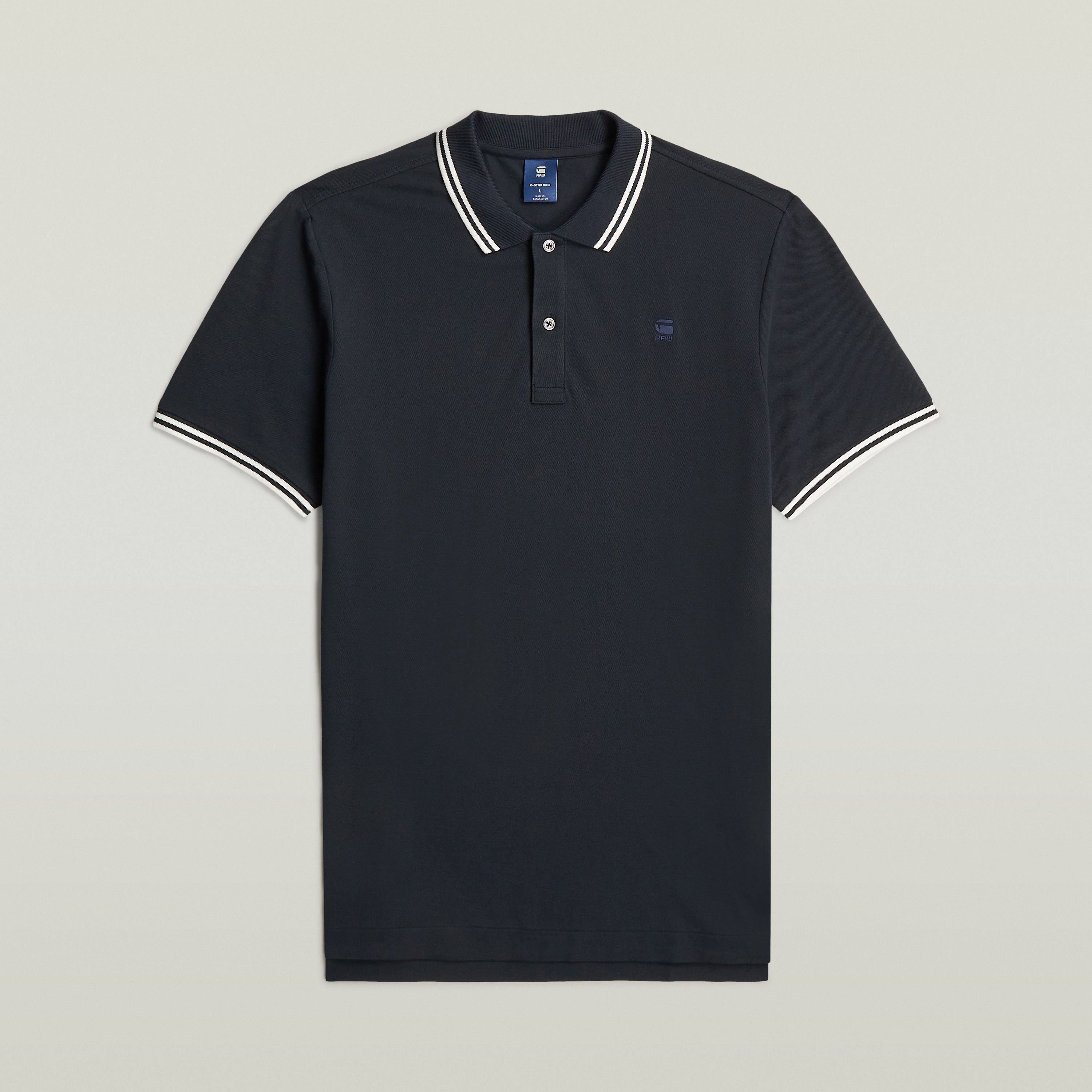 Polo Dunda Slim Stripe azul oscuro con corte ajustado y detalles de rayas, ideal como slim stripe polo shirt.