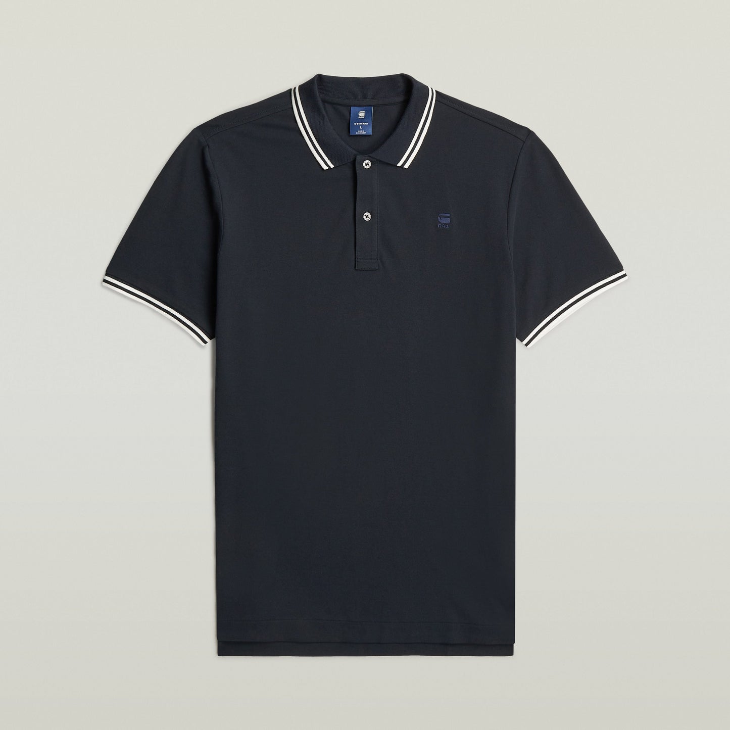 Polo Dunda Slim Stripe azul oscuro con corte ajustado y detalles de rayas, ideal como slim stripe polo shirt.