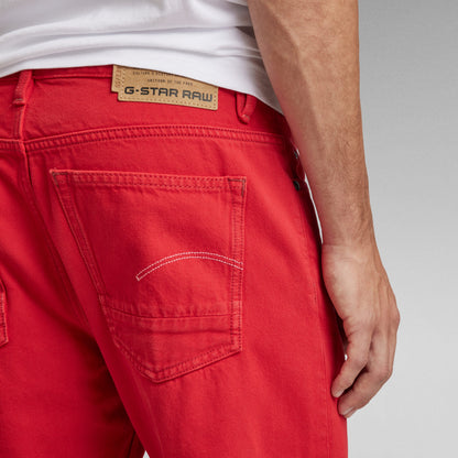 Close-up of G-Star RAW red jeans showcasing the back pocket and label, highlighting stylish design and detail.