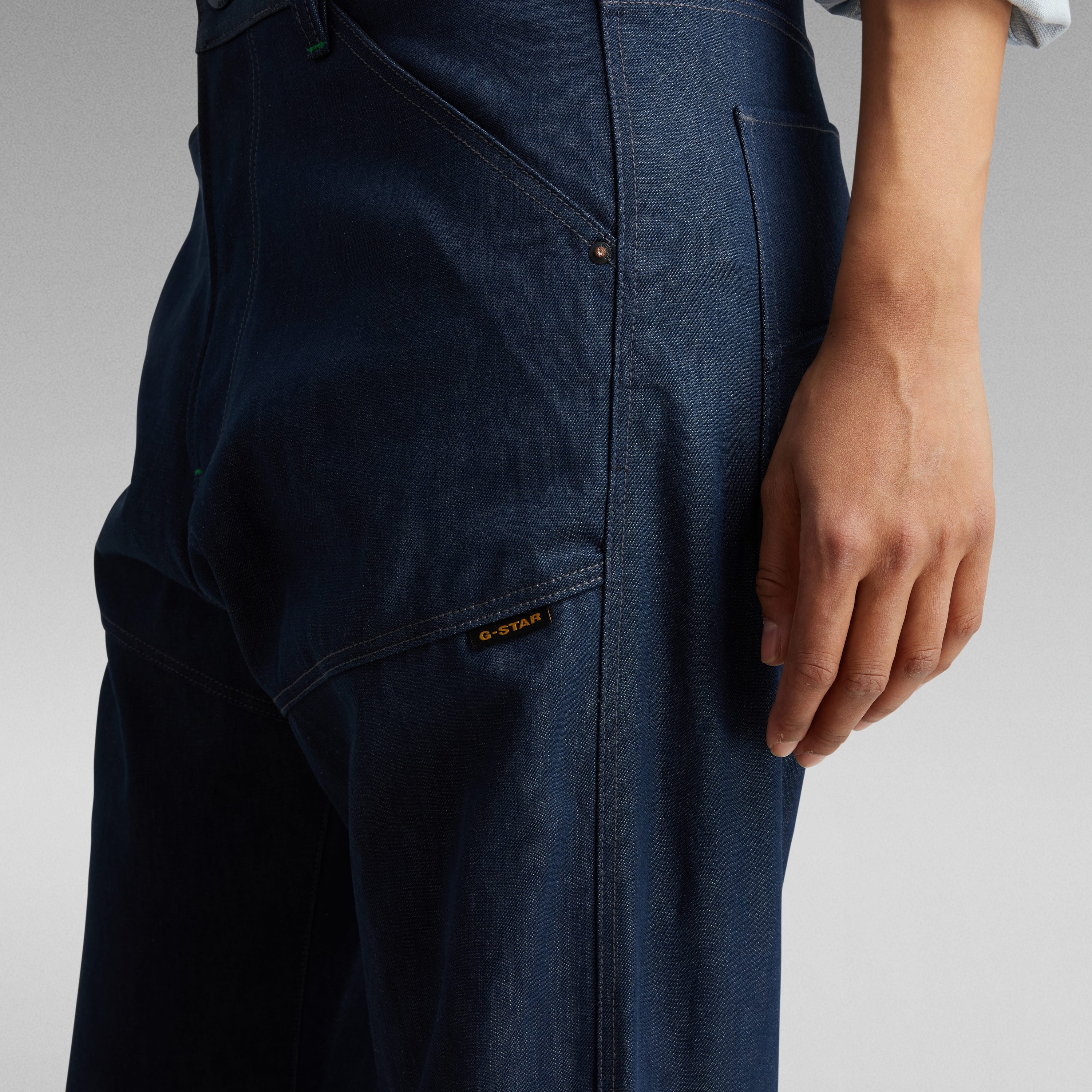 Close-up of a woman wearing G-Star bootcut jeans for women highlighting the back pocket and stitching details.