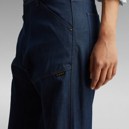 Close-up of a woman wearing G-Star bootcut jeans for women highlighting the back pocket and stitching details.
