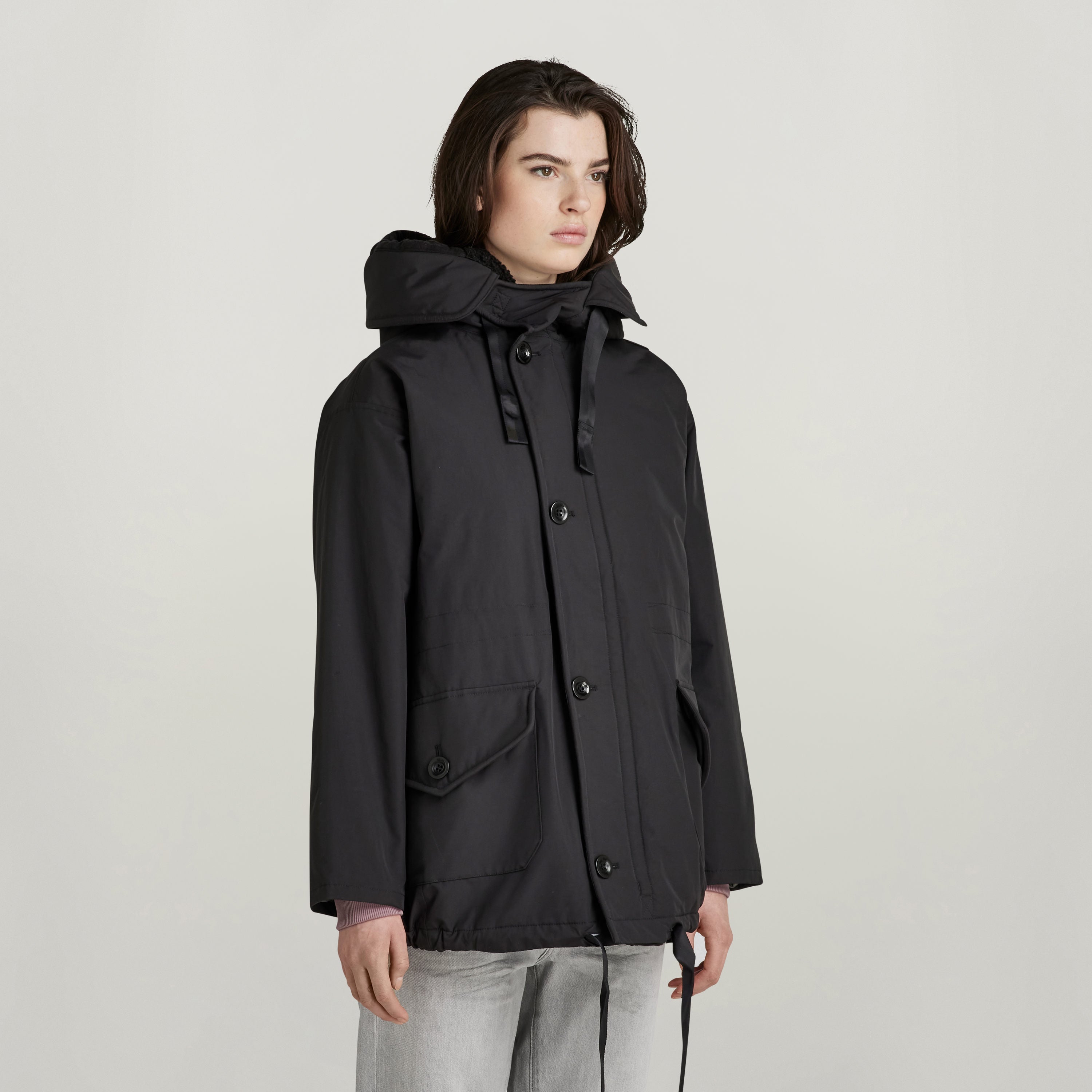 loose fit parka with hood in black, featuring a relaxed silhouette and large hood.
